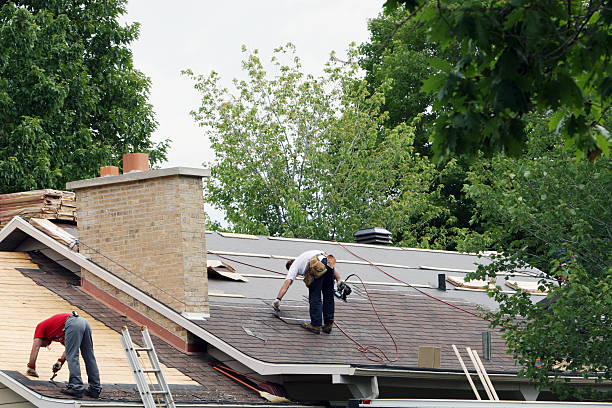 Roofing in Dallas County inspecting shingles on older brick home